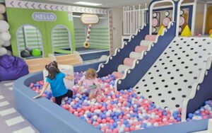 Real indoor playground setup showing commercial play equipment in use