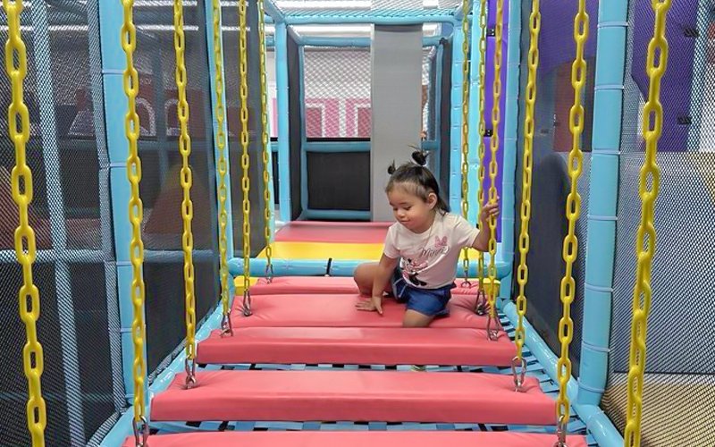 Indoor play facility layout supporting multiple income streams