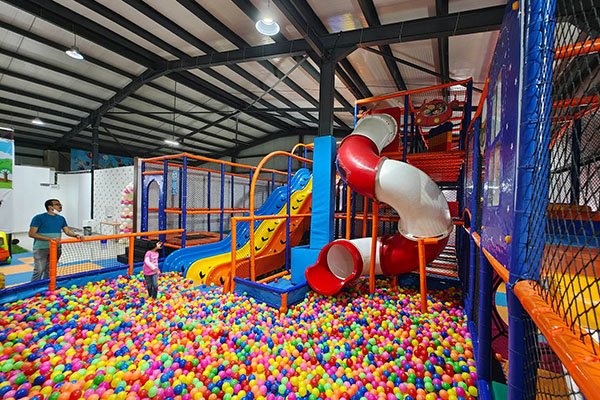 Main play area in an indoor playground opened in India, featuring soft play and colorful zones.